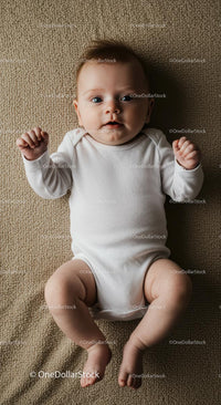 Adorable Baby in White Onesie on Cozy Beige Blanket