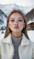 Young Woman in Winter Fashion with Snowy Mountain Backdrop