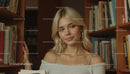 Blonde Woman Posing in Cozy Library Setting