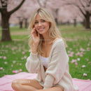 Smiling Woman in a Park with Cherry Blossoms