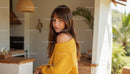 Woman in Yellow Sweater in Stylish Modern Home