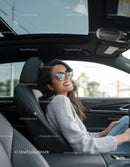 Happy Woman Relaxing in Modern Car Interior