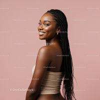 Smiling Woman with Braided Hair on Pink Background