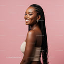Smiling Woman with Braids Against a Pink Background