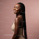 Smiling Woman with Braided Hair Against Serene Background