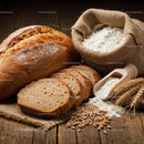 Rustic Loaf and Flour on Wooden Table with Wheat