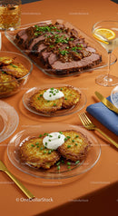 Gourmet Potato Pancakes and Beef Roast on Elegant Table