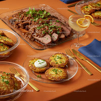 Gourmet Beef Dish with Potato Pancakes and Cocktail