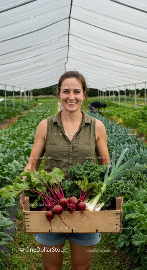 Woman Holding Harvested Vegetables in Greenhouse