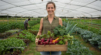 Woman Farmer Holding Fresh Harvest in a Greenhouse