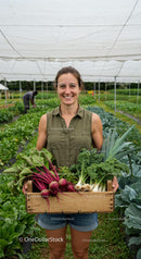 Smiling Woman Holding Fresh Organic Farm Vegetables