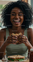 Joyful Woman Savoring a Delicious Burger Indoors