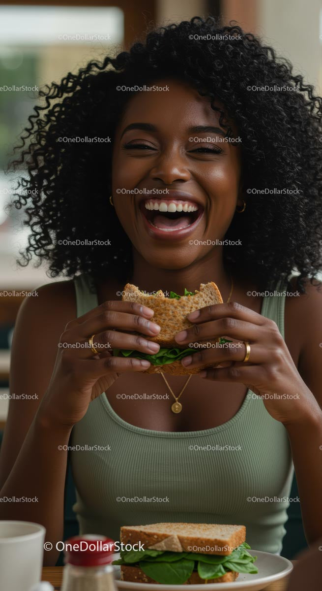 Joyful Woman Enjoying a Fresh Sandwich in a Cozy Cafe