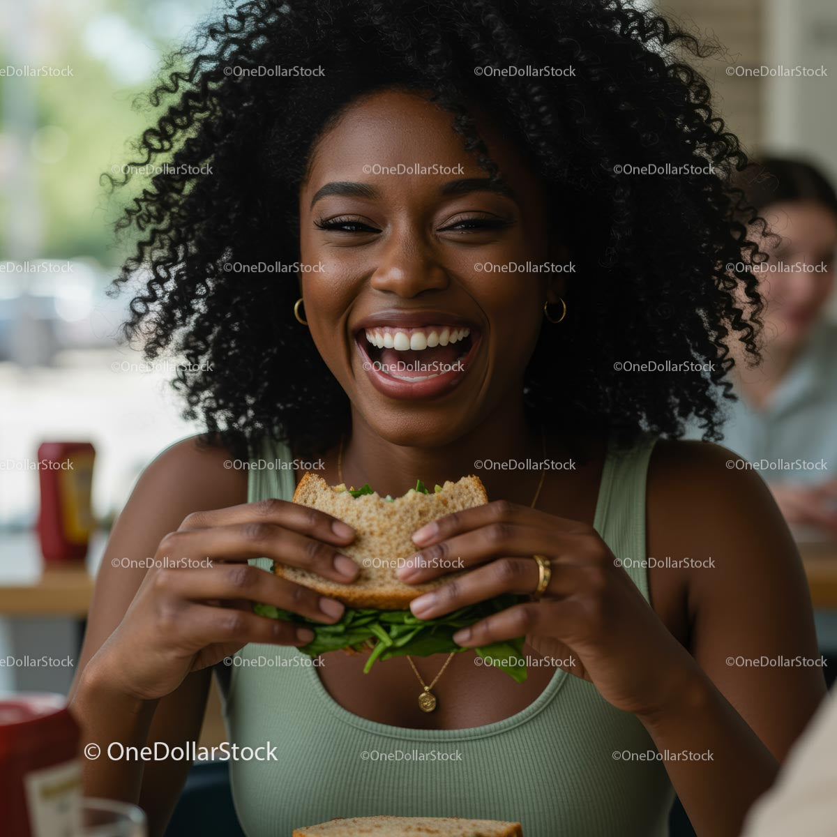 Joyful Woman Savoring a Delicious Burger Indoors
