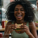 Joyful Woman Savoring a Delicious Burger Indoors