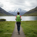 Woman Hiking Towards Snow-Capped Mountain in Iceland