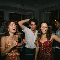 Smiling Friends Dancing at a Vibrant Night Party