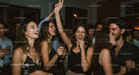 Joyful Friends Having Fun at a Night Party Gathering
