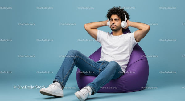 Relaxed Man Listening to Music on Purple Bean Bag