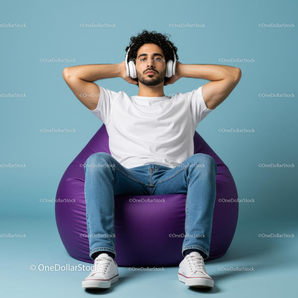 Man Relaxing on Purple Bean Bag Listening to Music