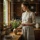 Woman Arranging Wildflowers in Rustic Kitchen