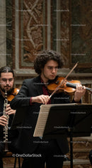 Violinist Performing in Elegant Concert Hall