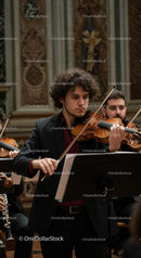 Talented Violinist Performing in Elegant Concert Hall