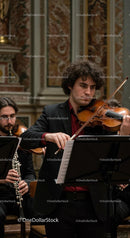 Talented Violinist Performing in Elegant Concert Hall