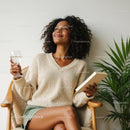 Relaxed Woman Enjoying a Book with Indoor Palm