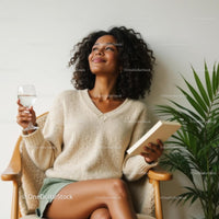 Relaxed Woman Enjoying a Book with Indoor Palm