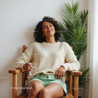 Relaxed Woman in Cozy Setting with Indoor Plant