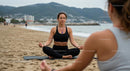 Women Practicing Yoga on Sandy Beach with Ocean View