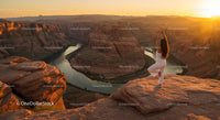 Silhouette of Woman Practicing Yoga at Scenic Canyon at Sunset
