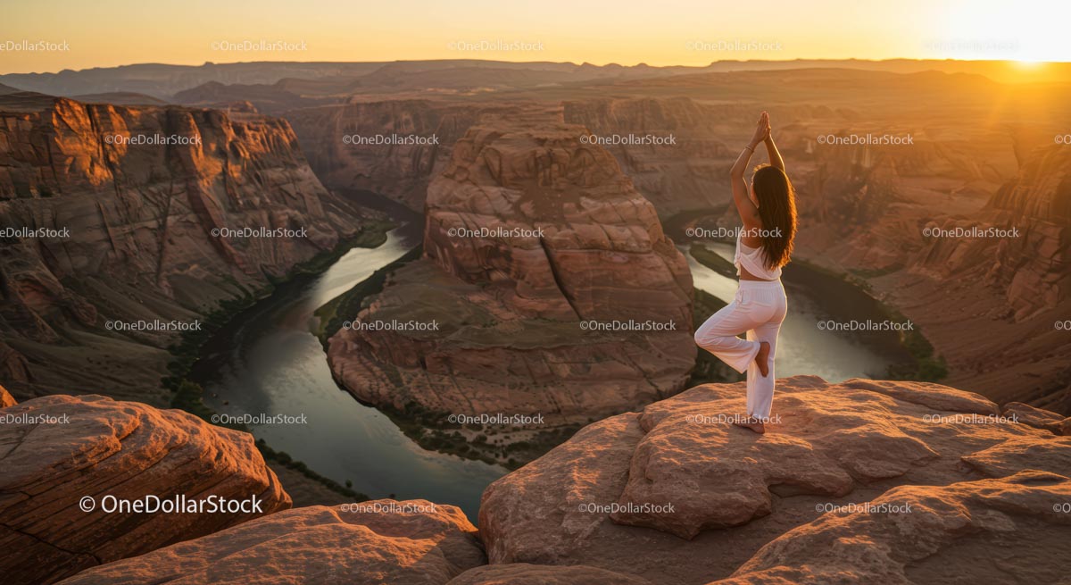 Woman Practicing Yoga at Sunset Over Majestic Canyon