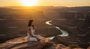 Silhouette of Woman Practicing Yoga at Scenic Canyon at Sunset