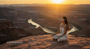 Silhouette of Woman Practicing Yoga at Scenic Canyon at Sunset