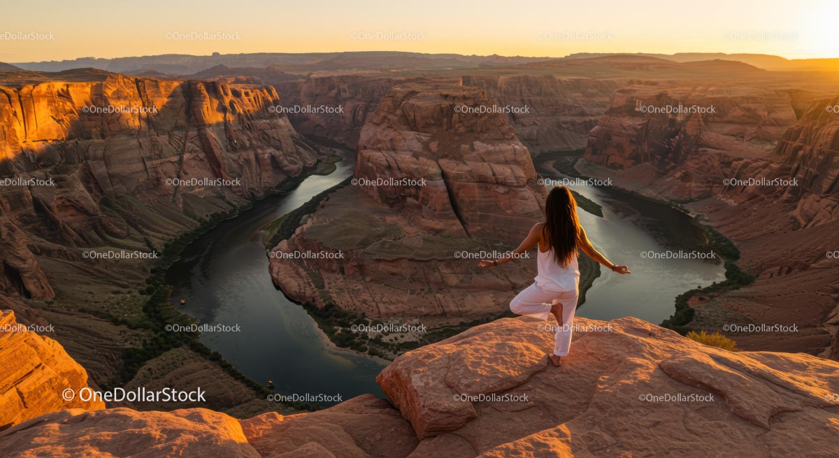 Silhouette of Woman Practicing Yoga at Scenic Canyon at Sunset