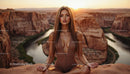 Woman Meditating at Sunset in Majestic Canyon Landscape
