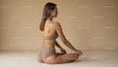 Woman Practicing Yoga in Calm Beige Setting