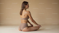 Woman Practicing Yoga in Calm Beige Setting