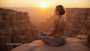 Silhouette of Woman Practicing Yoga at Scenic Canyon at Sunset
