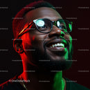 Smiling Man in Glasses with Vibrant Red and Green Lighting