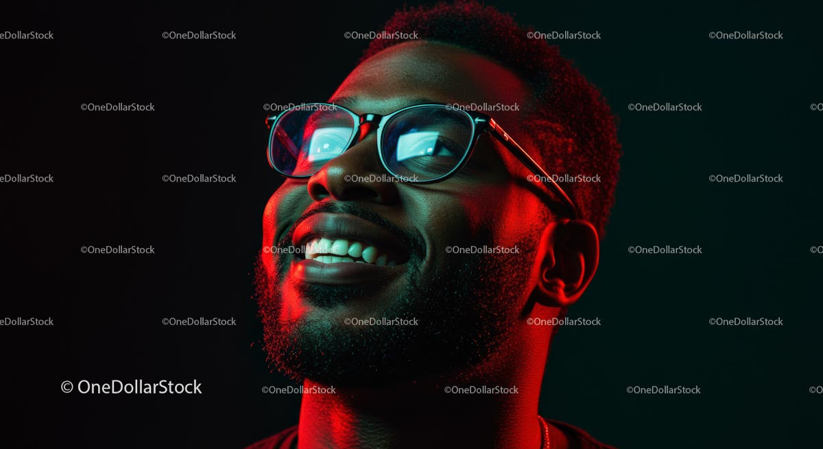 Smiling Man Wearing Glasses in Neon Red Light