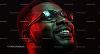 Smiling Man in Red Lighting with Glasses