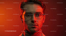 Young Man with Eyeglasses Against Red Background