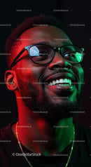 Smiling Man with Glasses Under Neon Lights