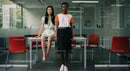 Diverse Women in Modern Office Setting with Minimal Design