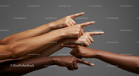 Diverse Hands Pointing in Unity Against Grey Background