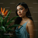 Woman in Blue Dress with Bird of Paradise Flower