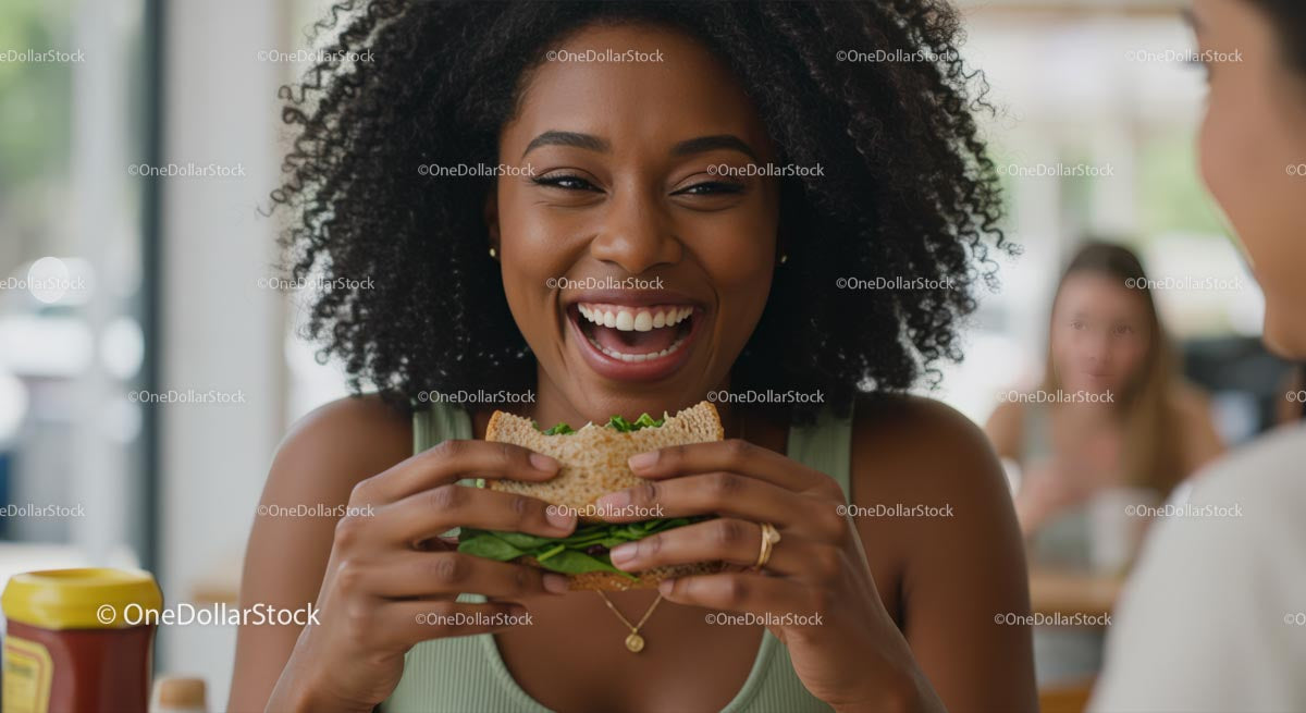 Joyful Woman Enjoying a Fresh Sandwich at Lunch